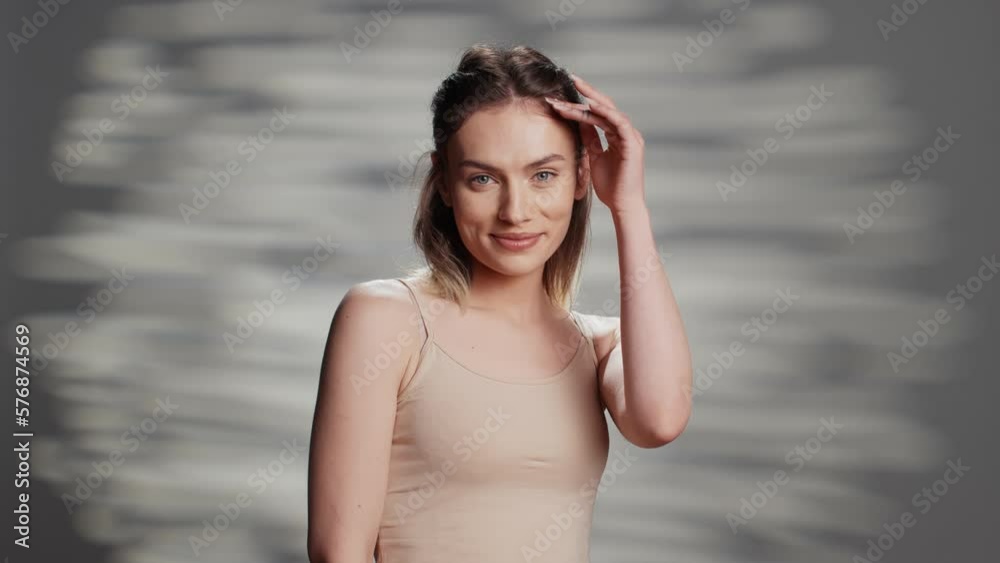 Flawless beauty model doing empowering campaign for self love and body positivity, using skincare cosmetics. Young beautiful adult feeling positive and confident, advertising tenderness.
