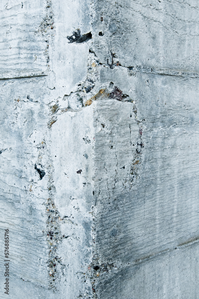 Obraz premium Texture of board formed concrete wall showing wood grain and stone aggregate. 
