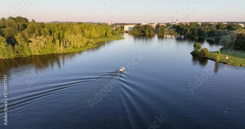 Aerial view around a boat moving towards the Hameenlinna city, summer sunset in Finland photo