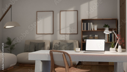 Interior design of modern workspace in contemporary cozy living room, laptop on white stone table © bongkarn