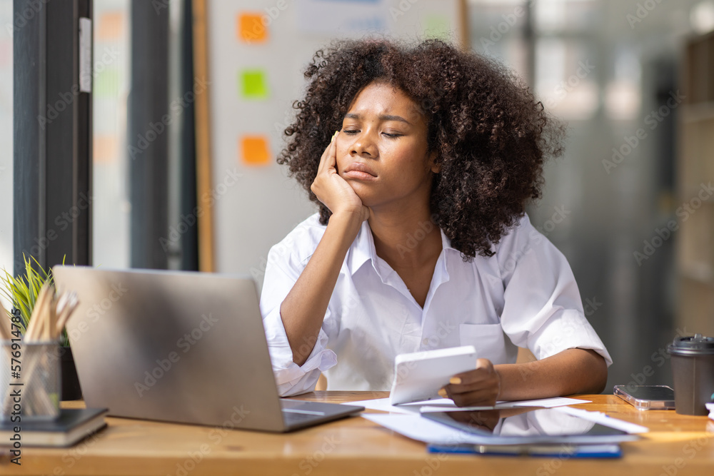 Portrait of tired young business african american woman work with documents tax laptop computer in office. Sad, unhappy, Worried, Depression, or employee life stress concept
Portrait of tired young business african american woman work with documents tax laptop computer in office. Sad, unhappy, Worried, Depression, or employee life stress concept