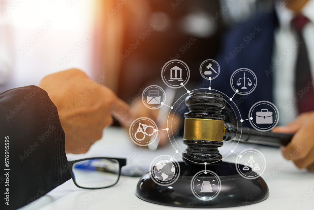 judge on wooden table And experienced lawyers meet with clients and give advice behind the scenes. legal services legal consulting concept judge on wooden table And experienced lawyers meet with clients and give advice behind the scenes. legal services legal consulting concept