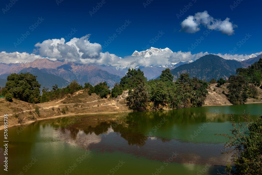 Deoriatal, Uttarakhand, India, Deoria Tal, Devaria or Deoriya lake at Sari village , Garhwal Himalayas, famous for snow capped chaukhamba mountains in the backdrop. It is considered sacred by Hindus. Deoriatal, Uttarakhand, India, Deoria Tal, Devaria or Deoriya lake at Sari village , Garhwal Himalayas, famous for snow capped chaukhamba mountains in the backdrop. It is considered sacred by Hindus.