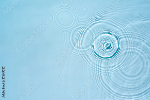Background with round rings on the water surface, aqua texture
