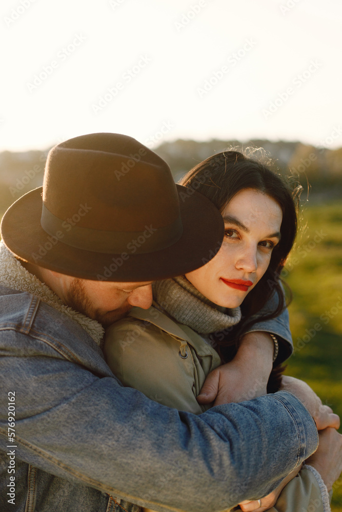 Cropped portrait of a stylish romantic couple on a nature Cropped portrait of a stylish romantic couple on a nature