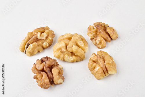 Ripe walnut without shell on white background