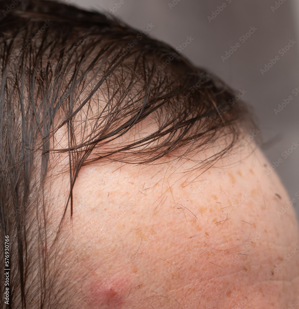 men's haircut with scissors and clipper in the salon men's haircut with scissors and clipper in the salon