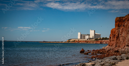 The view of the storage facility against the water and red sand at Ardrossan beach, Yorke Peninsula.