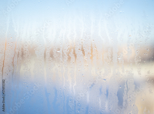 Misted glass on the window as an abstract background.
