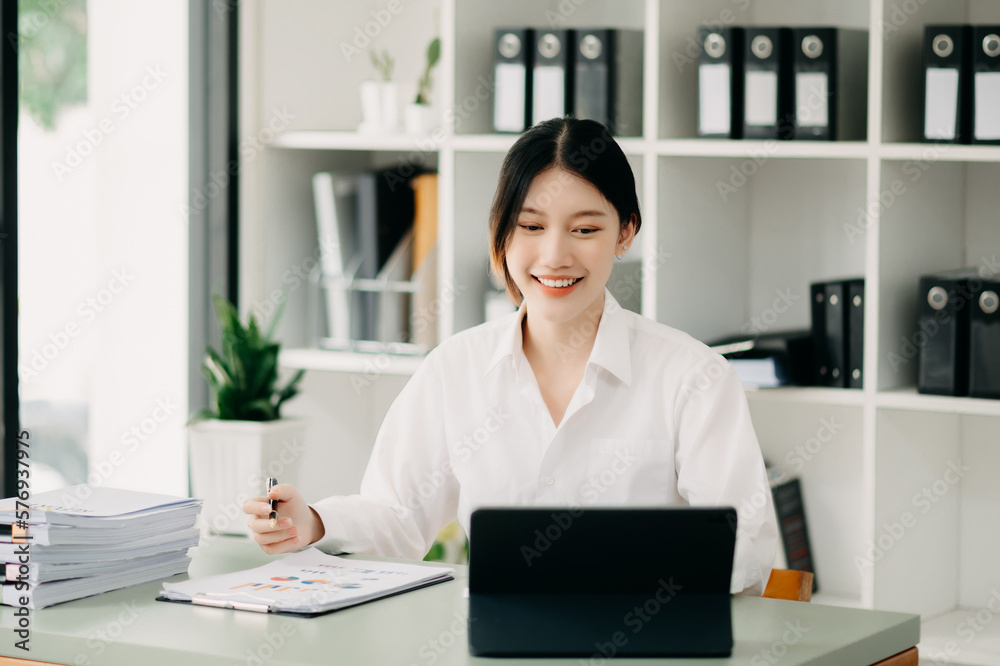 Woman freelancer is working her job on computer tablet and laptop Doing accounting analysis report real estate investment data, Financial at office. Woman freelancer is working her job on computer tablet and laptop Doing accounting analysis report real estate investment data, Financial at office.