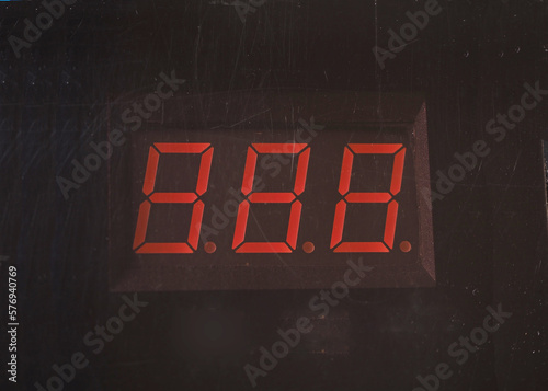 3-digit number led display with dirty face. Scratched face on dim display.