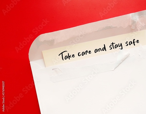 Envelope with handwriting - Take Care and Stay Safe - concept of caring message to other to take good care during the COVID-19 Coronavirus pandemic