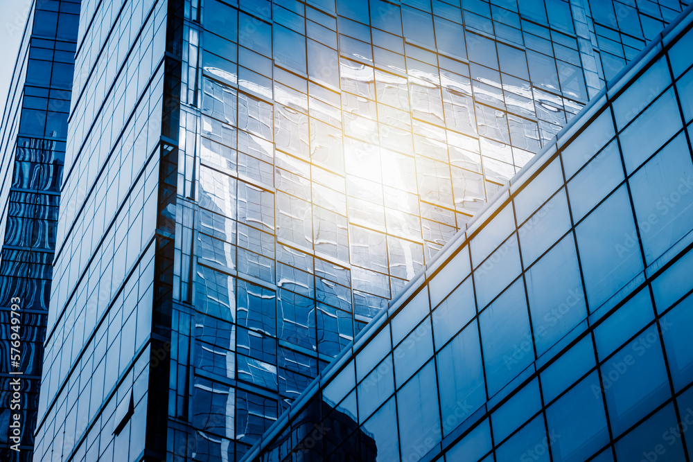 Obraz premium background of the glass modern office building.