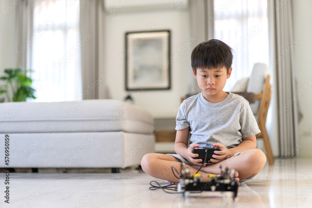 Portrait happy kid little asian boy son having fun hobby leisure lifestyle activity learn and skill brain training play with toy STEM education science control robot technology learning at home Portrait happy kid little asian boy son having fun hobby leisure lifestyle activity learn and skill brain training play with toy STEM education science control robot technology learning at home