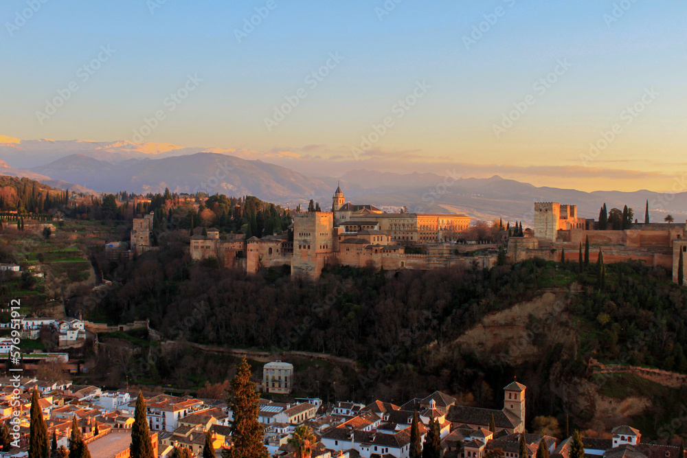 view over the alhambra of Granada with snow covered mountains in the background