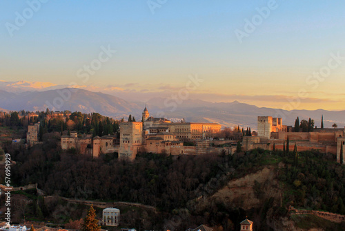 view over the alhambra of Granada with snow covered mountains in the background