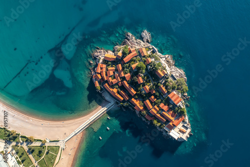 Aerial panoramic view of the famous tourist location Sveti Stefan island and picturesque Adriatic coastline near the city of Budva, Montenegro photo