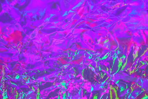 Abstract holographic background in 80s, 90s style. Modern bright neon colored crumpled metallic psychedelic holographic foil texture. Synthwave, vaporwave, psychedelic retro futurism, syberpunk