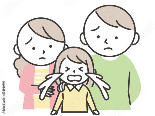 泣いている女の子と彼女を心配する両親