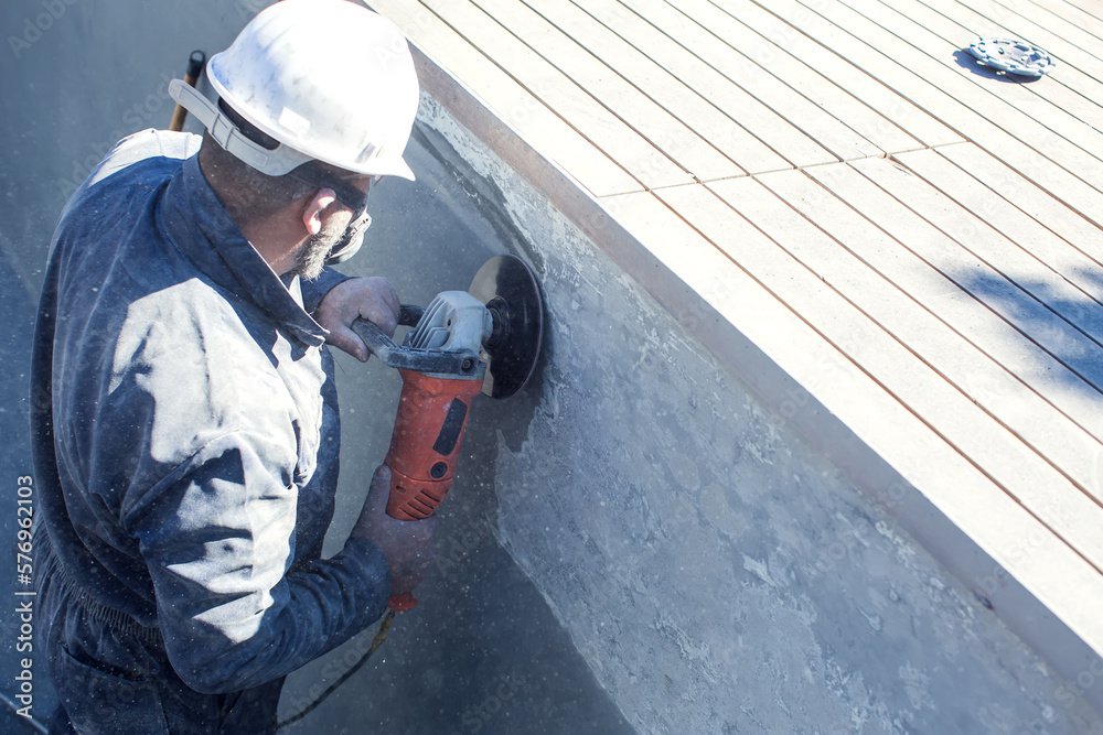 Concrete ceiling surface of the pool grinding by angle grinder Concrete ceiling surface of the pool grinding by angle grinder