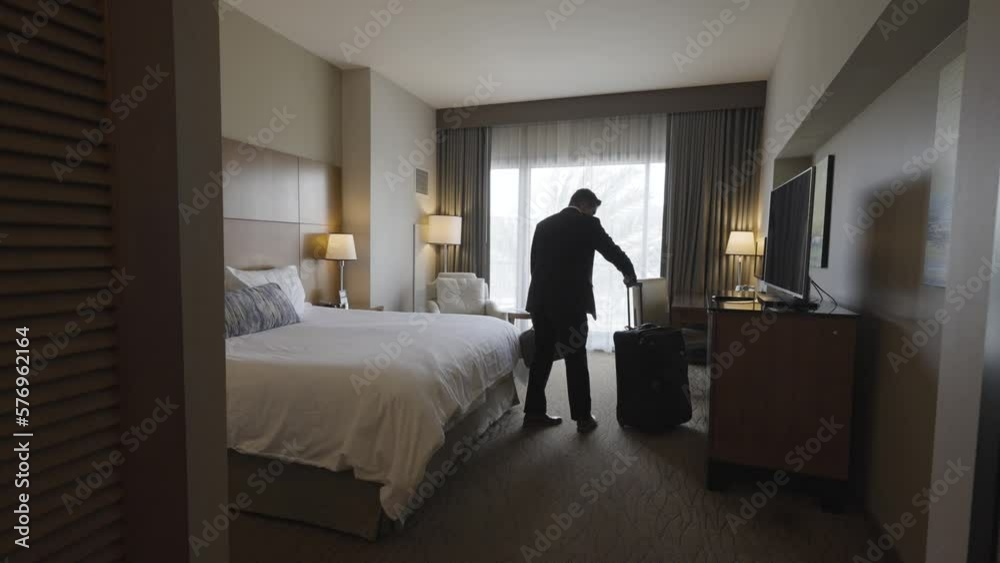 Business Man in Suit Entering Hotel Room - Exhausted Falling Back on Bed