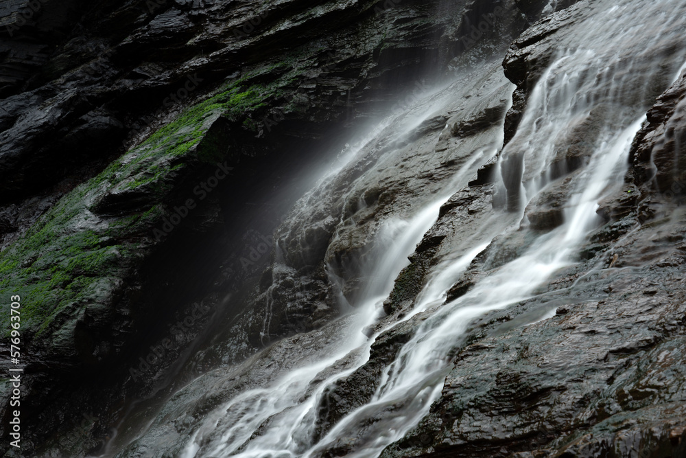 Fototapeta premium Close up of a silky Waterfall in As Catedrais beach (Cathedrals beach). Lugo, Galicia, Spain
