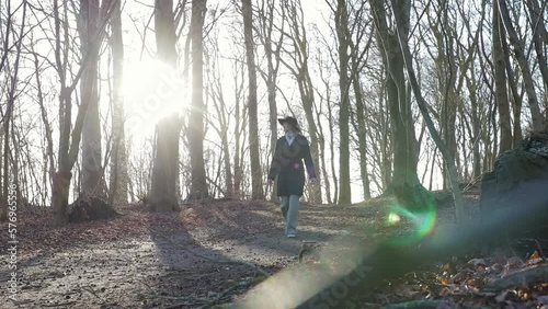 young girl walking alone in forest