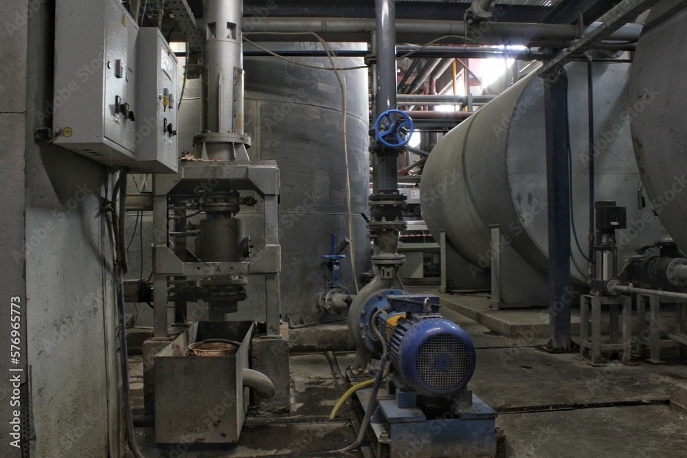 Steel pipes, tubes, steam turbine, valves, machinery, cables of modern factory. Gas boiler room of industrial zone power plant. Pump engineering station. Technical equipment system. Energy concept.