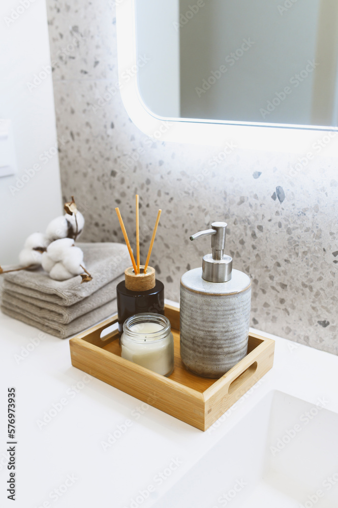 modern luxury bathroom details. Hand soap dispenser, candle, towels in  white and grey tones. Scandinavian minimalistic interior style. Stock Photo  | Adobe Stock