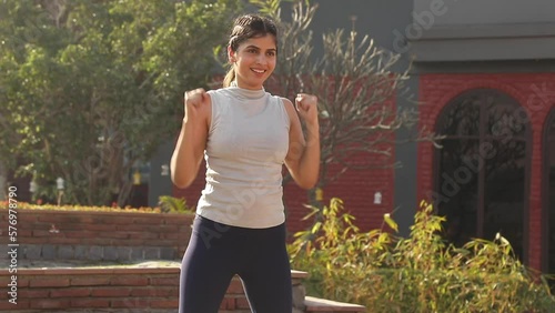 Stock Video of a gorgeous fit Indian woman performing cardio exercise.