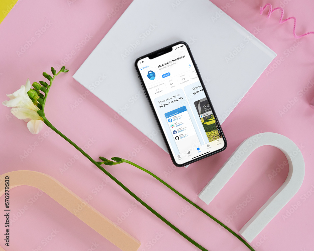 Mobile phone with Microsoft Authenticator App Store screen Stock Photo