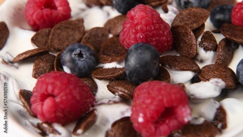 Close up shot of chocolate cereal with fruit. photo