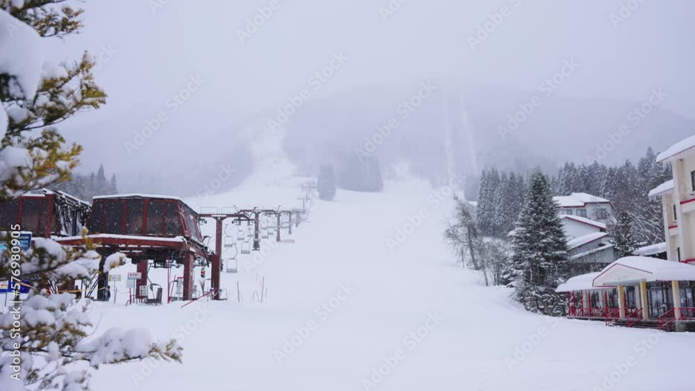 Beautiful Empty Ski Field and Chair Lift in the Mountains with No People Beautiful Empty Ski Field and Chair Lift in the Mountains with No People