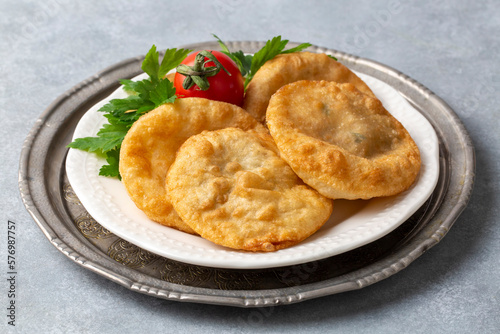 Delicious meat pie from Turkish cuisine. Fried handmade pies. Turkish name; fincan boregi or puf borek