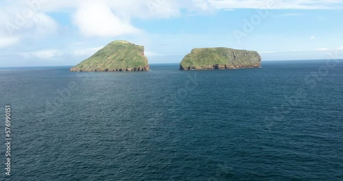 Aerial View Of Cabras Islets In The Middle Of Blue Sea In Daytime In Terceira Island, Azores, Portugal. photo