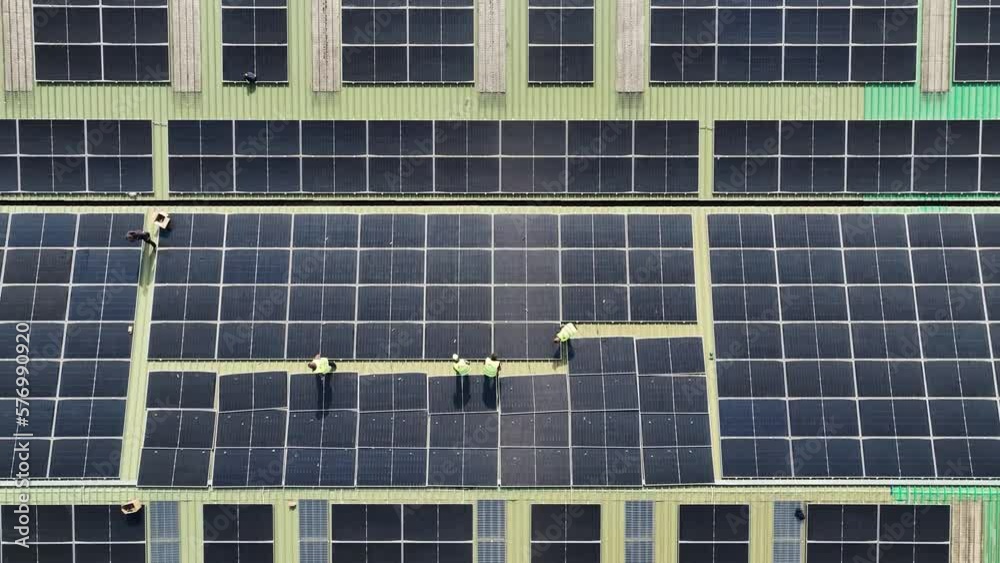 Installation of photovoltaic panels on factory roof Installation of photovoltaic panels on factory roof