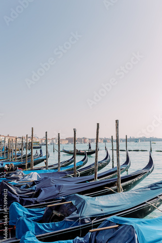 Countless gondolas are docked in the port of Venice. Waiting for the next passenger to travel to new adventures. © Miriam