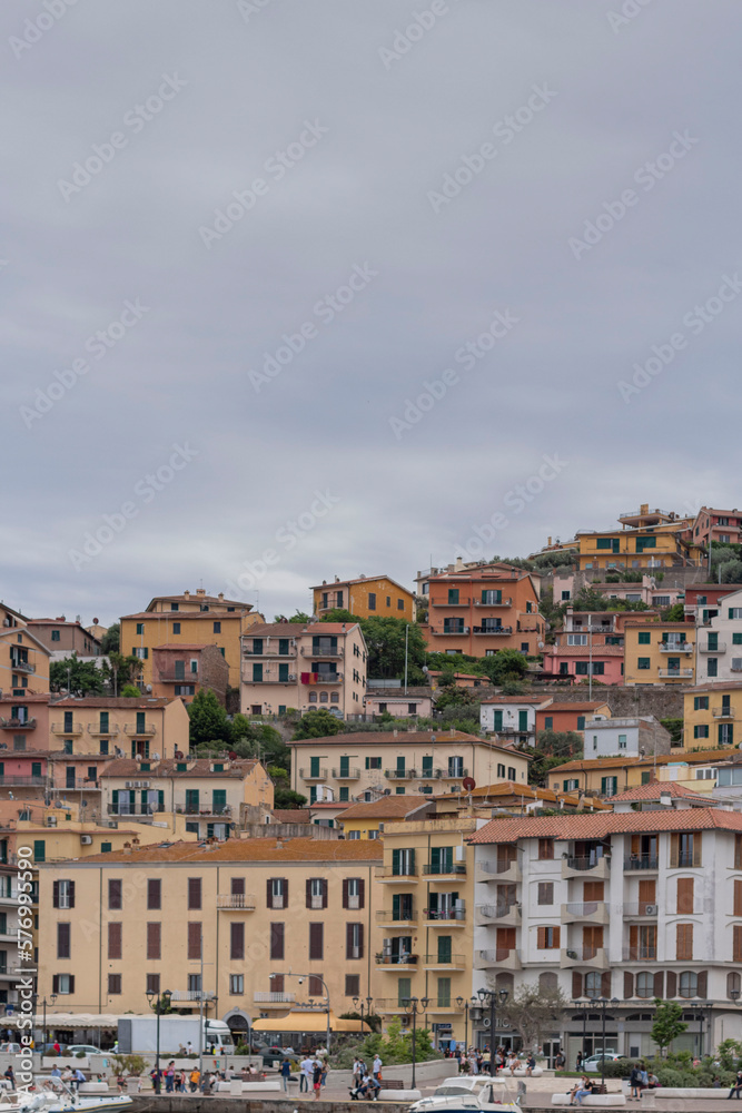 city view from the sea to the city of porto santo stefano