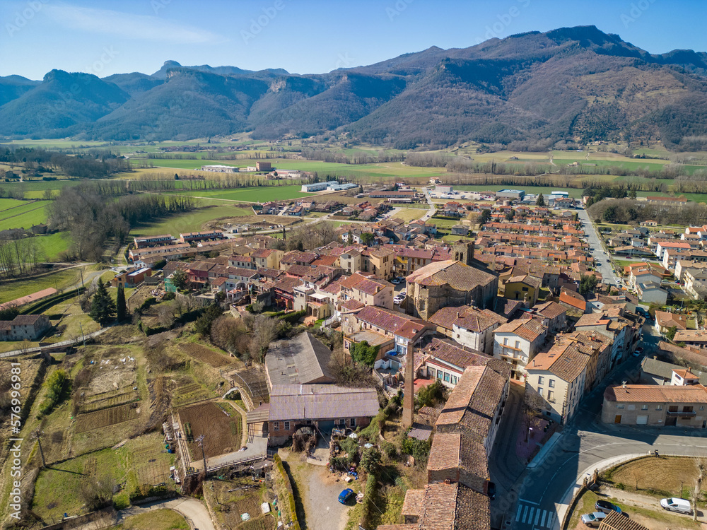 aerial image of la garrotxa in girona la vall d'en bas historic medieval town with beautiful mountains in the background