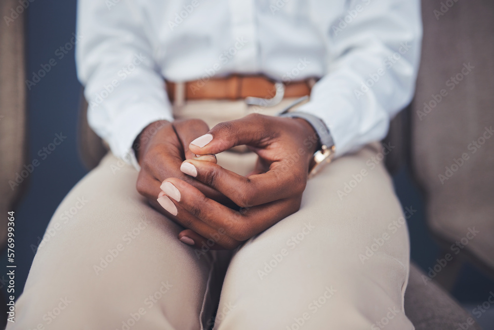Nervous, hands and woman waiting for an interview or hr business meeting in a corporate office. Anxiety, stress and professional African female employee playing with her hand in the workplace. Nervous, hands and woman waiting for an interview or hr business meeting in a corporate office. Anxiety, stress and professional African female employee playing with her hand in the workplace.
