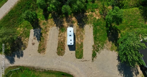 Aerial view above a camper, parked at a camping area in Lapland, Finland - top down, drone shot photo