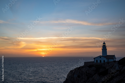 Sunrise from sea with lighthouse © YS