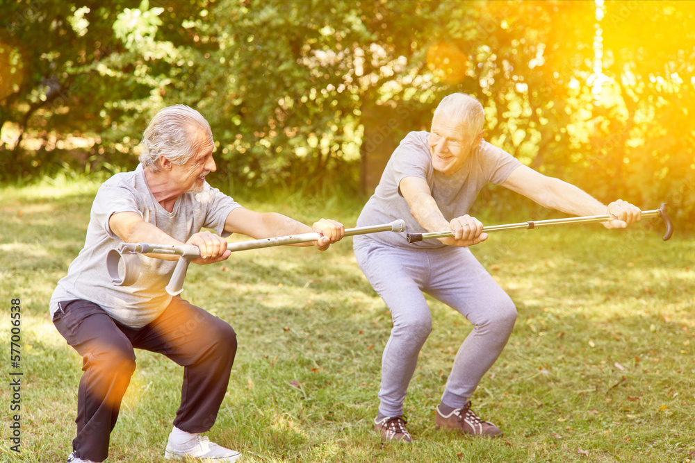 Two seniors train squats as a fitness exercise Two seniors train squats as a fitness exercise