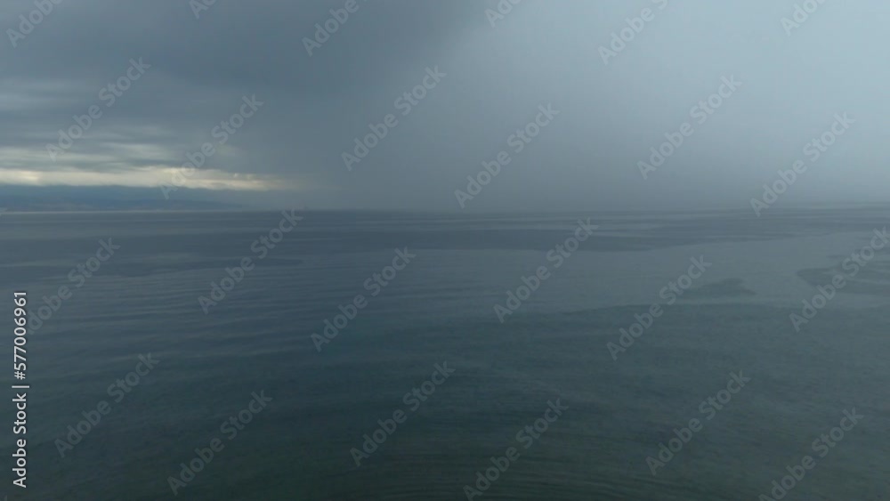 Stormy rain cloud over the sea, summer tempest at the Adriatic sea coastline Stormy rain cloud over the sea, summer tempest at the Adriatic sea coastline
