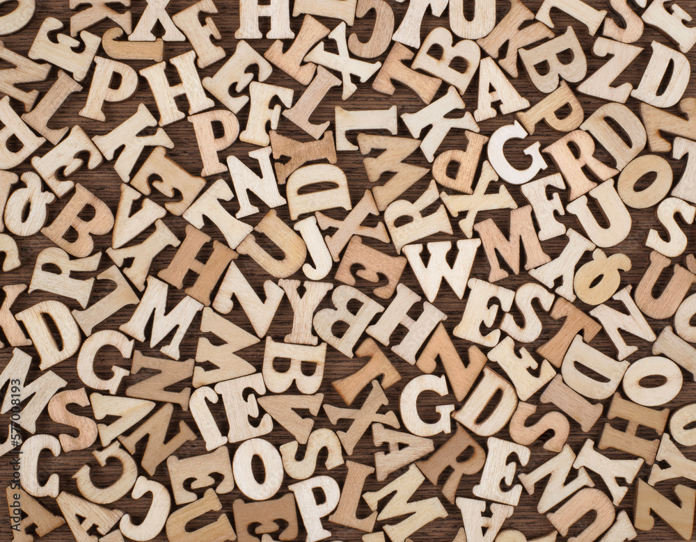 Vintage Wooden Letters on Brown wooden Background.