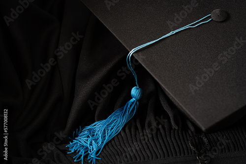 Leinwand Poster Black Graduation Cap university pace on graduation gown graduation concept