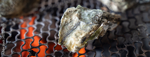 Grilled fresh oyster in Taiwan, famous street food. photo