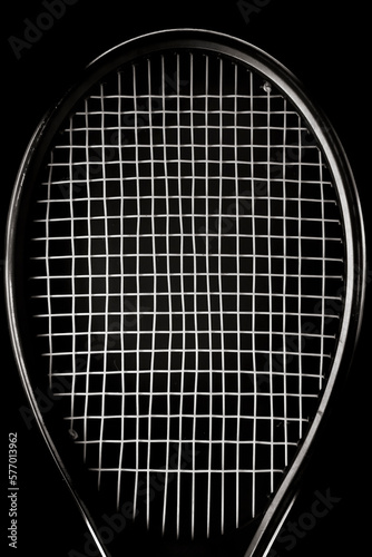 Close up view in black and white of the top of a tennis racket lit by rim light © Marco Taliani
