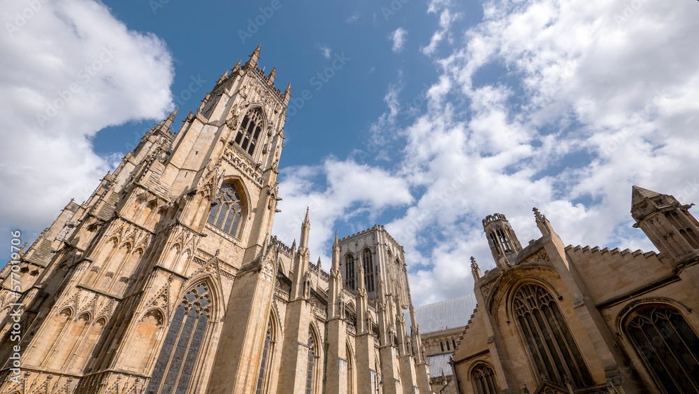 Fototapeta premium Extreme wide angle looking up at York Minster in sunshine - Room for copy