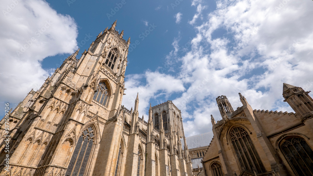 Extreme wide angle looking up at York Minster in sunshine - Room for copy